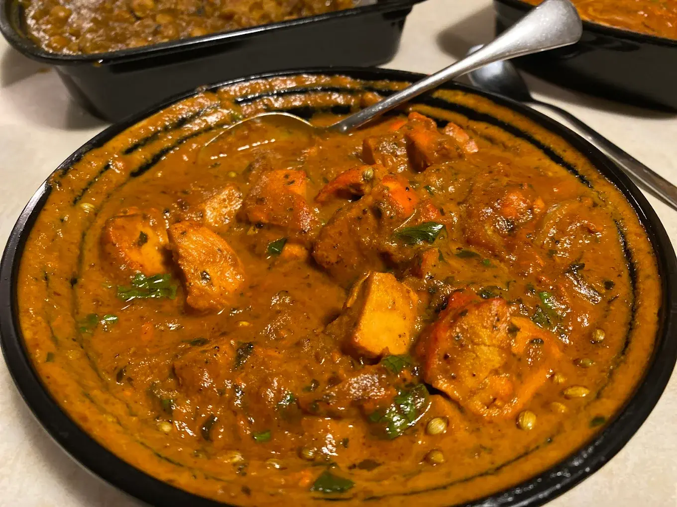 Fresh biryani and curries prepared for delivery at Indian Food Corner Winnipeg